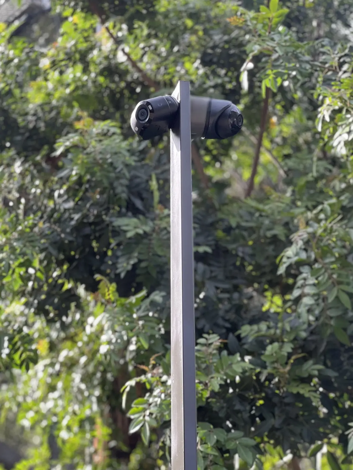 Close view of a custom black security post with multiple exterior cameras installed by Three Factor Security — Three Factor Security fieldwork in West Hollywood